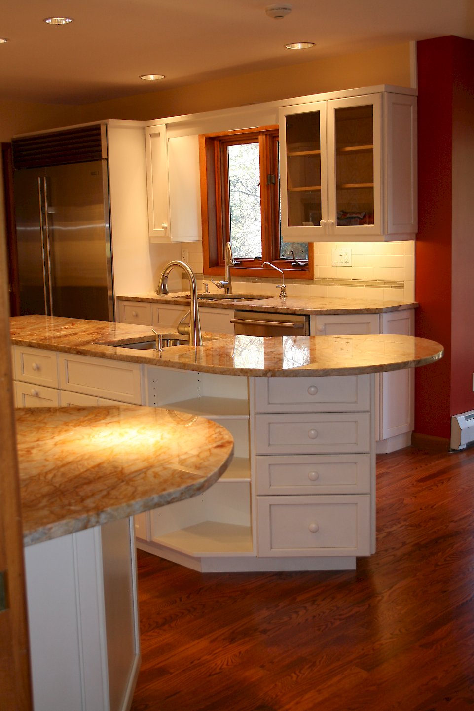 Plenty of drawers and open shelving in the kitchen island.