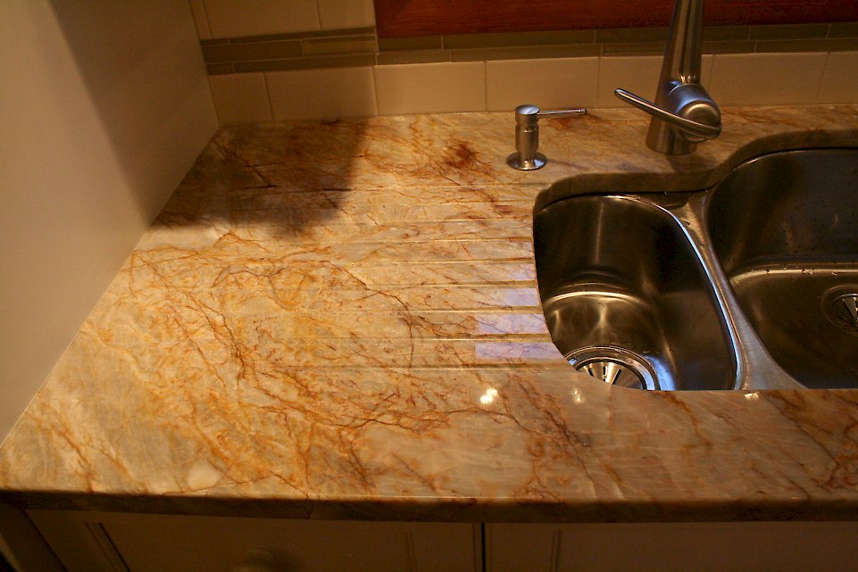 Drainboard grooves next to the undermount sink.