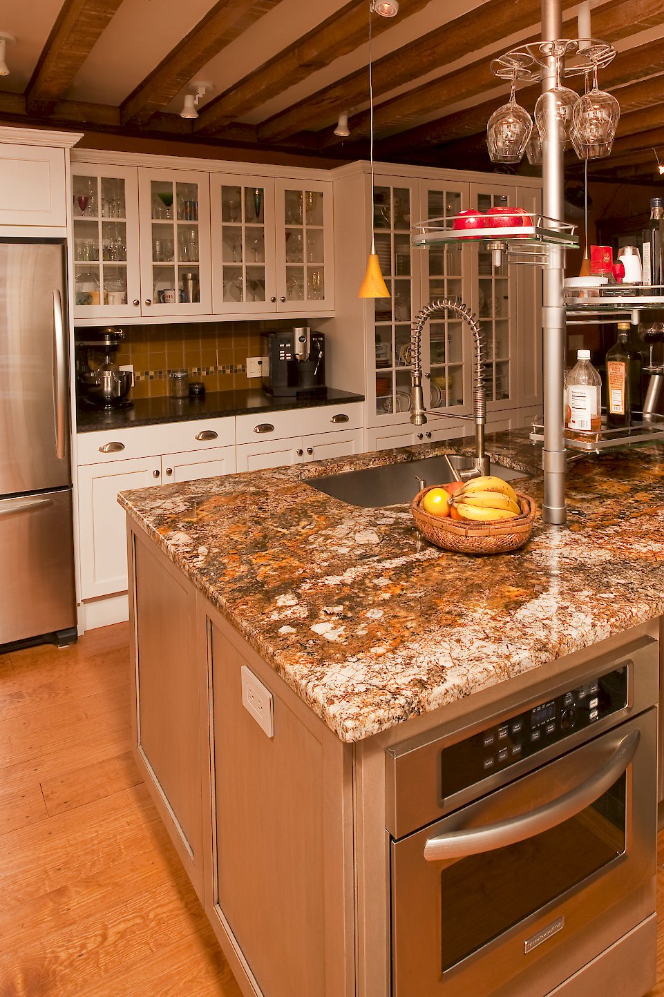 A Kitchen Aid KBMS1454SSS microwave in the island.