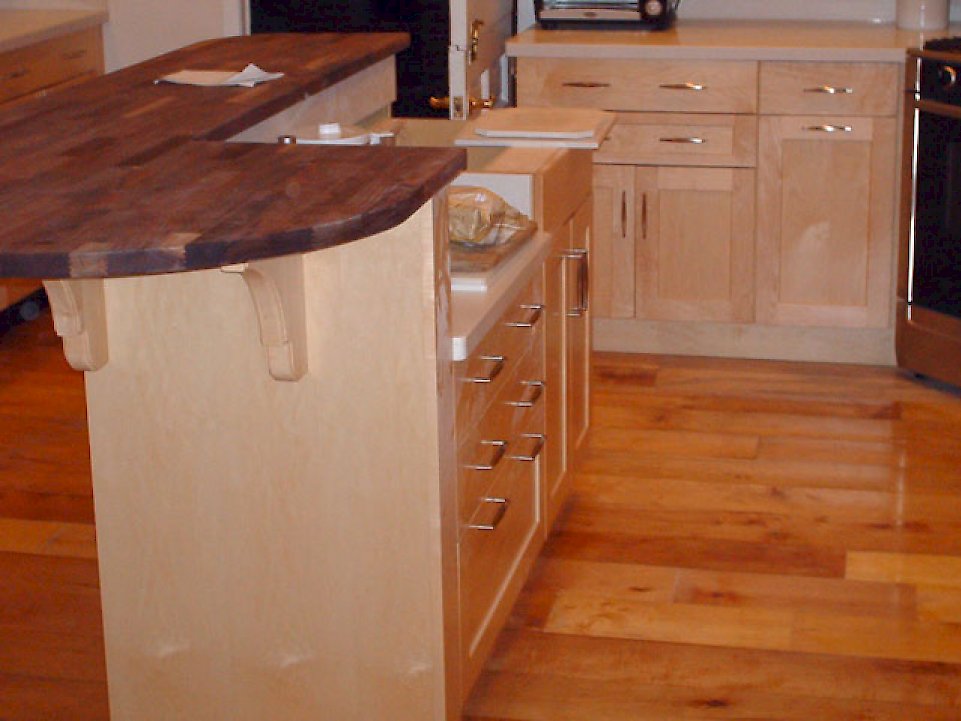 Black walnut butcher block counter on the island.