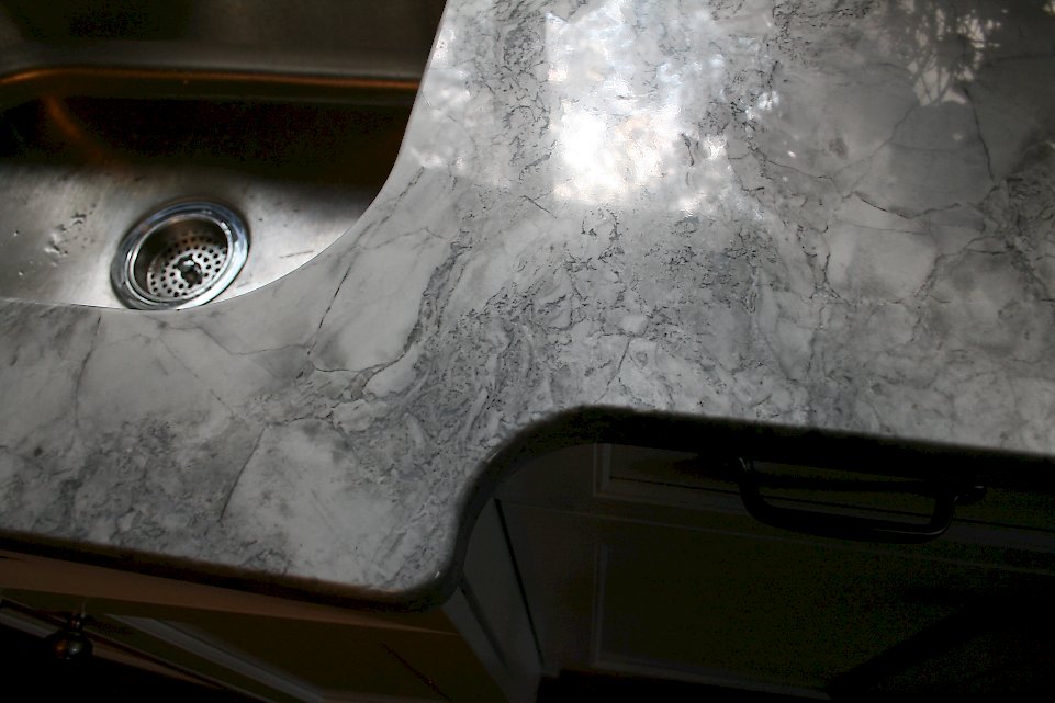 View of the curve on the counter near the sink base.