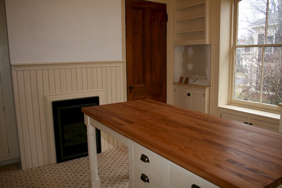 Bead board around the fireplace.