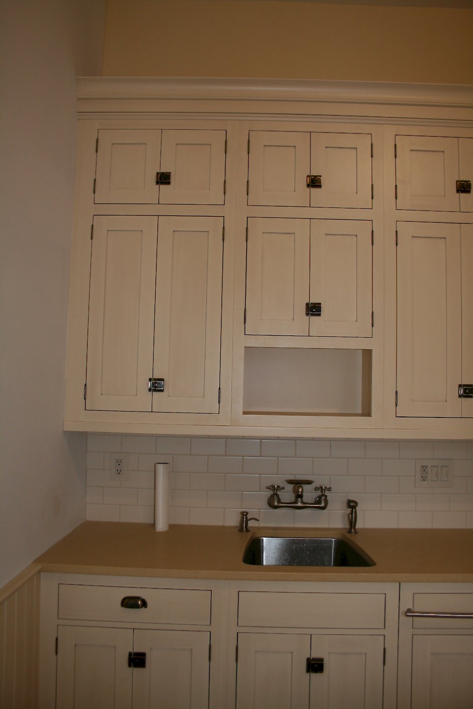 Undermount stainless sink. and wall faucet.