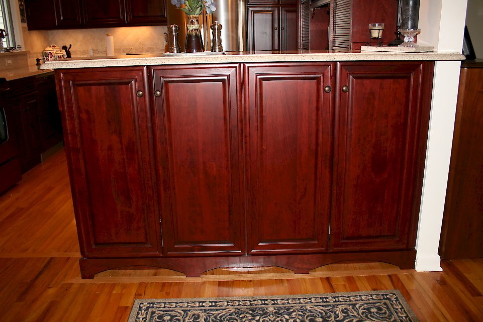 Doors on the outside of the kitchen peninsula.