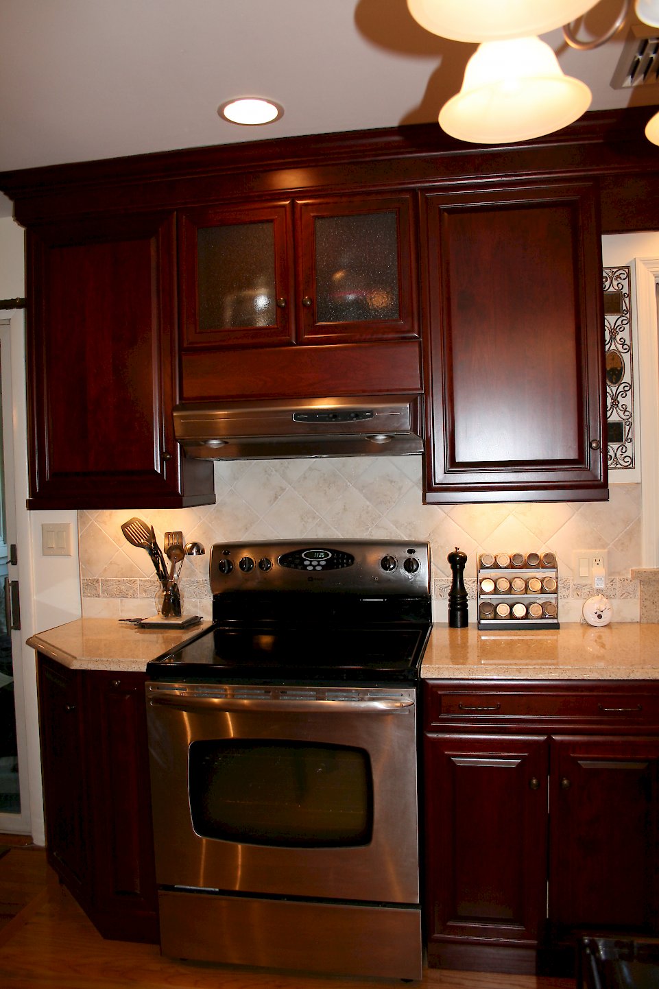 Stainless steel range, and hood.