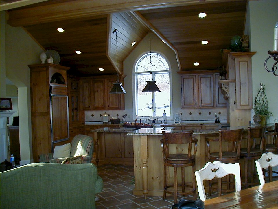 A Distressed Pine Wood-Mode kitchen with an Essex Door style.