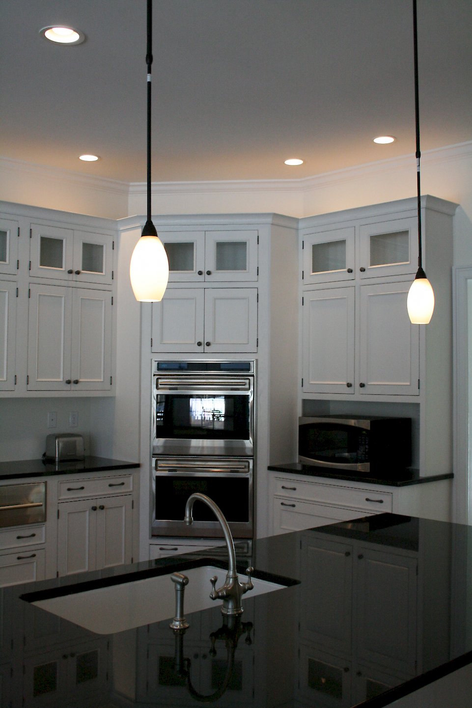 Further away view of the double oven and microwave.