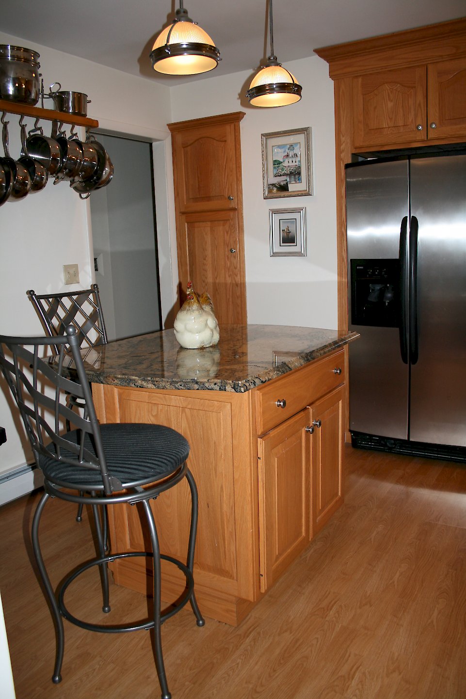 Tall cabinet recessed into the wall.