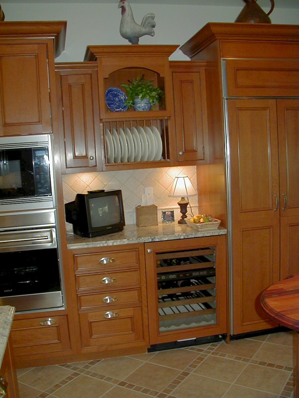 A Sub-Zero 424/O wine storage with a wood panel