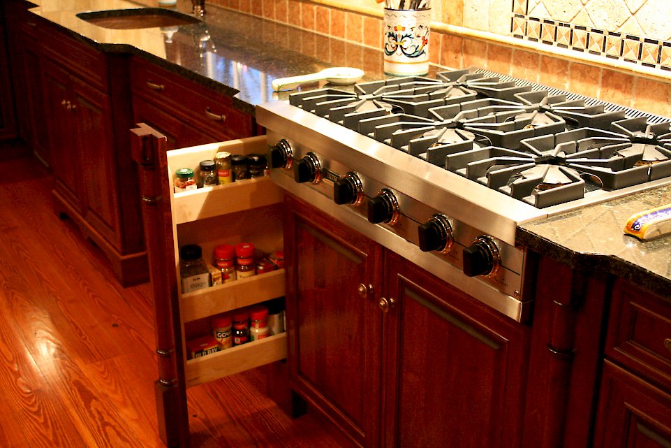 Wolf CT 15I/SS stainless cooktop and spice pullout.