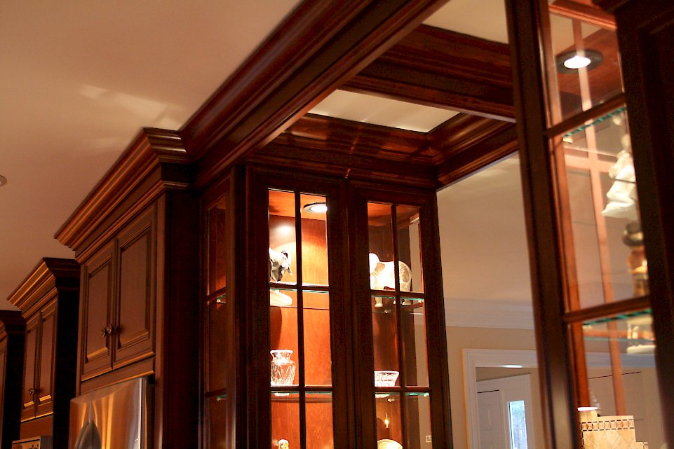 Lighting in the glass cabinets with glass shelving.