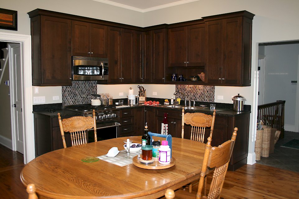 Knotty cherry kitchen with a dark lager finish.