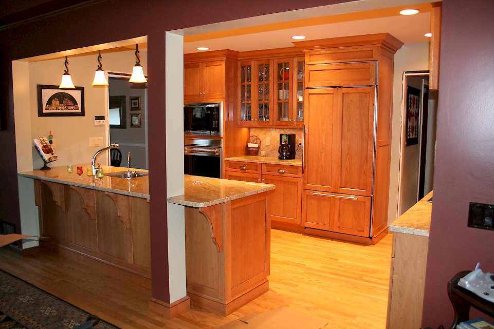 A wood-paneled Sub-Zero 650/O refrigerator.