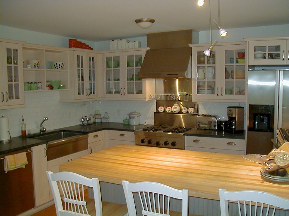 Jenn Air appliances and a maple butcherblock top on the kitchen island.