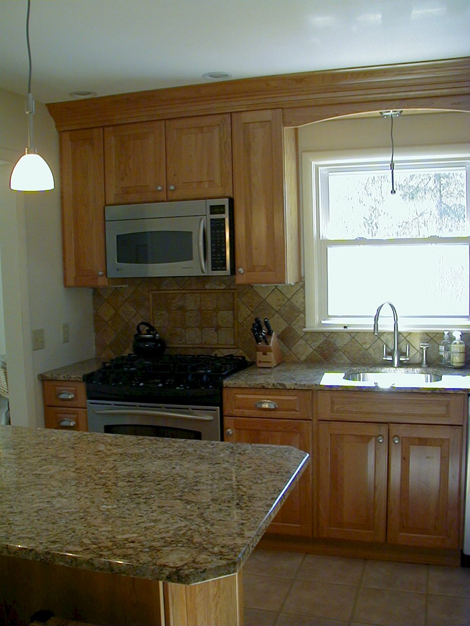 View of the cabinetry above microwave/hood.