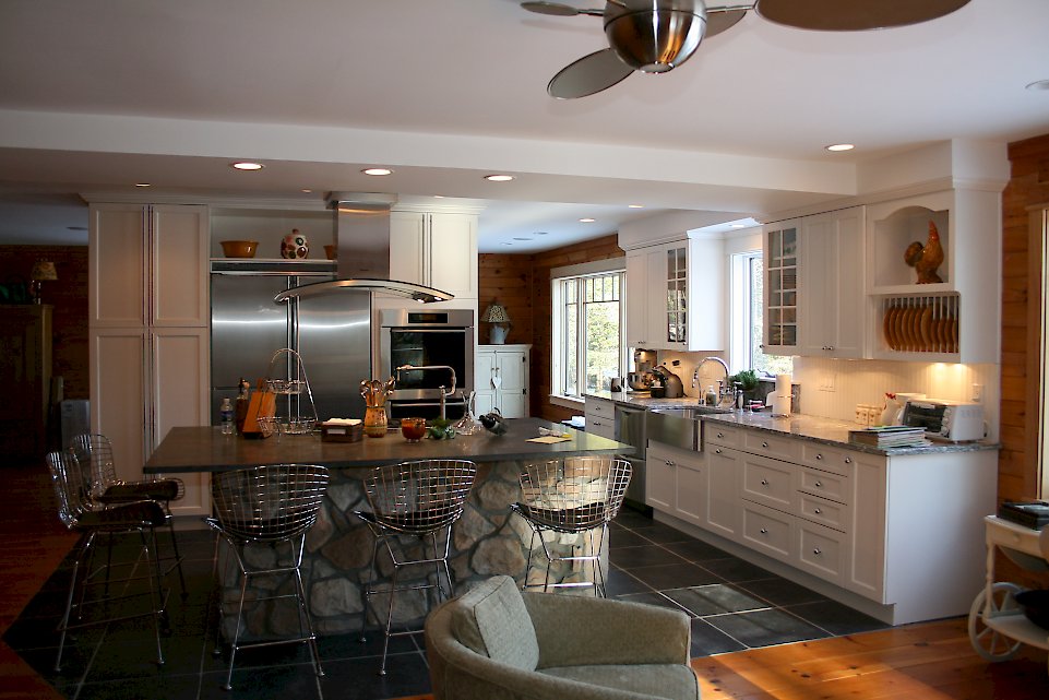 A Nordic White Kitchen With a large island.
