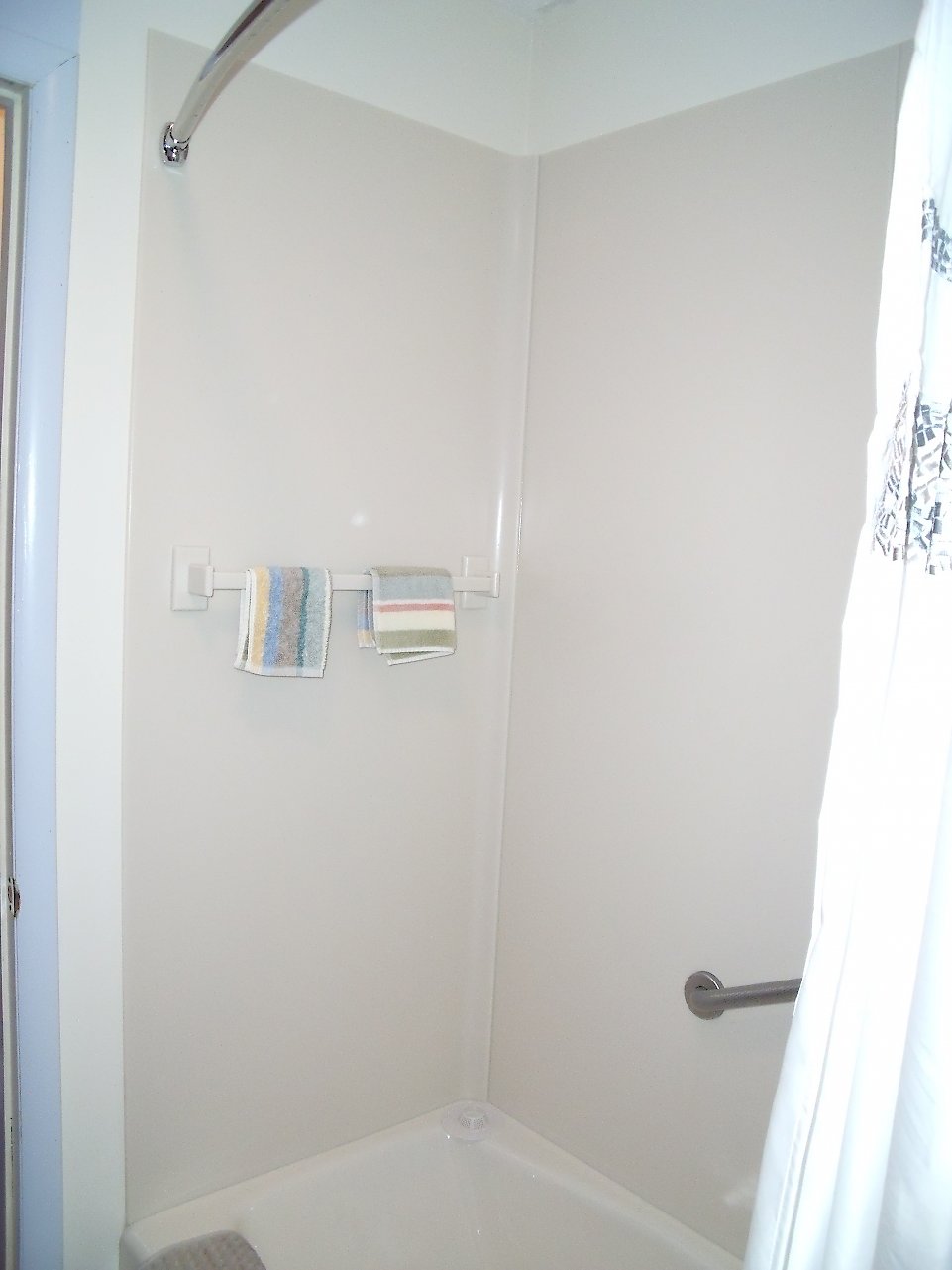 Corian tub surround in the shower.