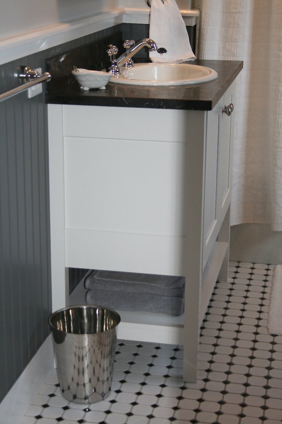 Nordic white vanity on feet.